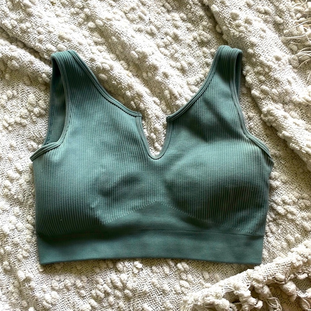 Blueish/green crop top with a v cut.